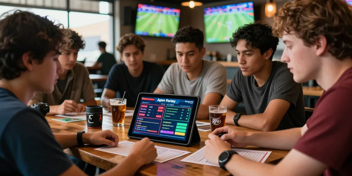 Agen Parlay Idngoal players strategizing over a tablet in a lively sports betting environment.